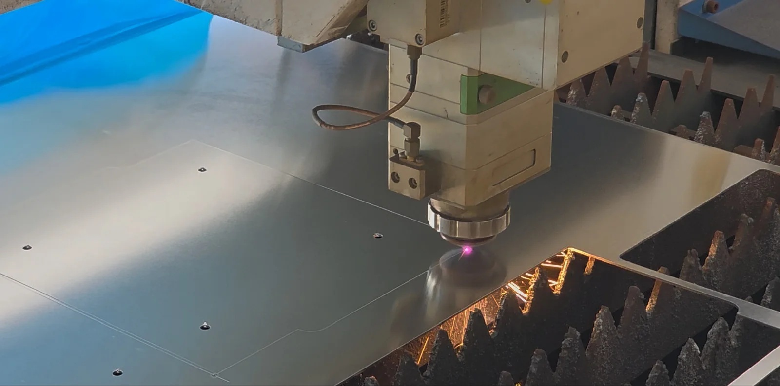 Fibre laser cutting metal in Scapemedia’s workshop